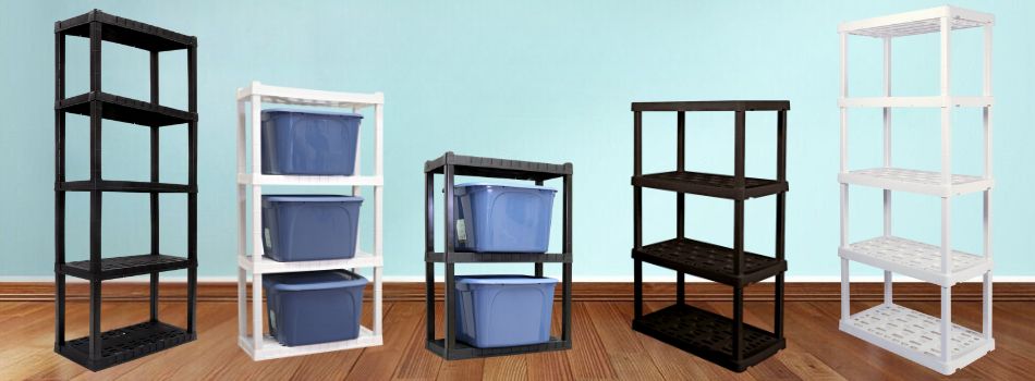 Three black and two white Oskar storage shelves on a wood floor in front of an aqua wall