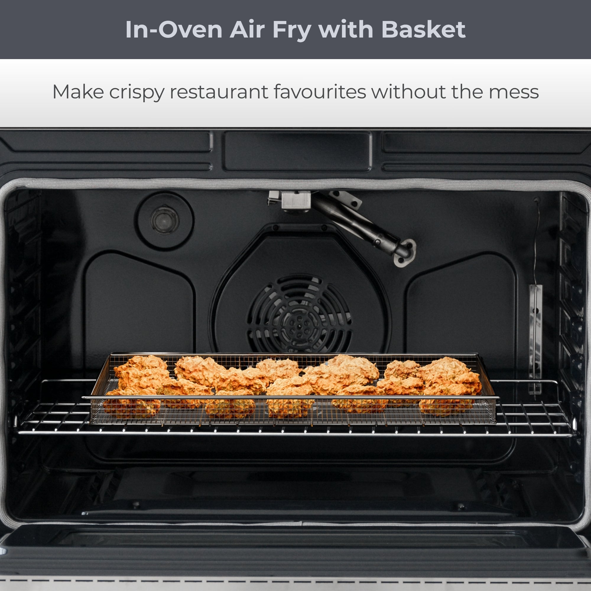 Closeup of oven interior with food cooking in air fryer basket. Text above reads, "In-Oven Air fry with Basket: Make crispy restaurant favourites without the mess."