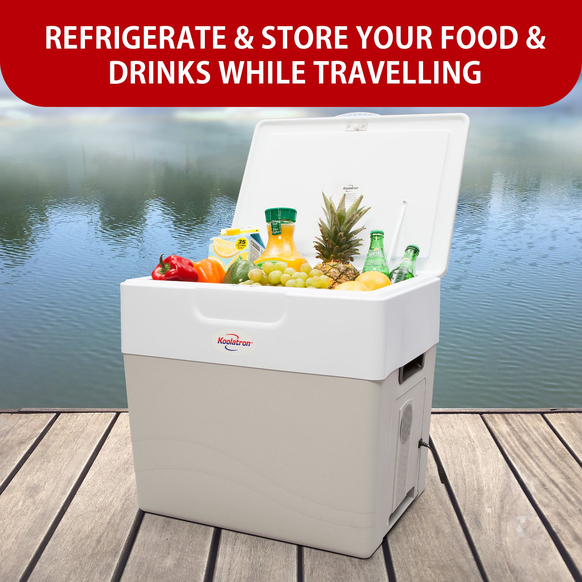 Koolatron portable 12V cooler/warmer open and filled with food and drinks on a dock with water and trees in the background. Text above reads, "REFRIGERATE AND STORE YOUR FOOD AND DRINKS WHILE TRAVELING"