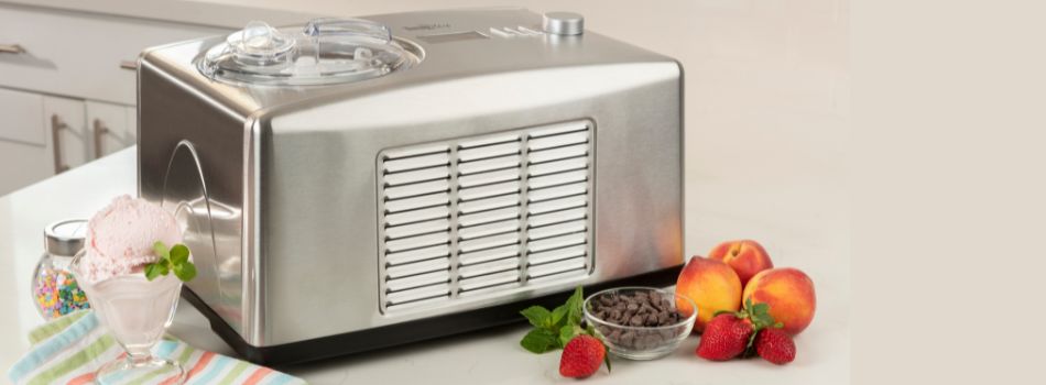 Stainless steel automatic ice cream and yogurt maker on a white kitchen counter