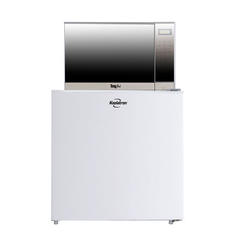 Microwave on top of fridge on a white background