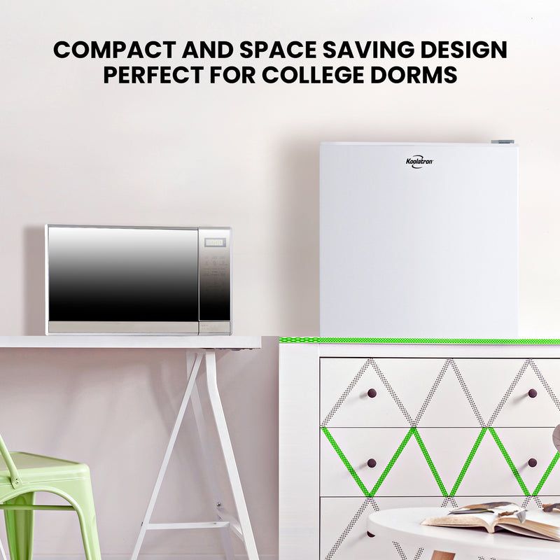 Microwave on a white desk with a light green chair to the left and fridge on top of a white drawer unit with a green and black geometric pattern on the front. Text above reads: Compact and space saving design perfect for college dorms.