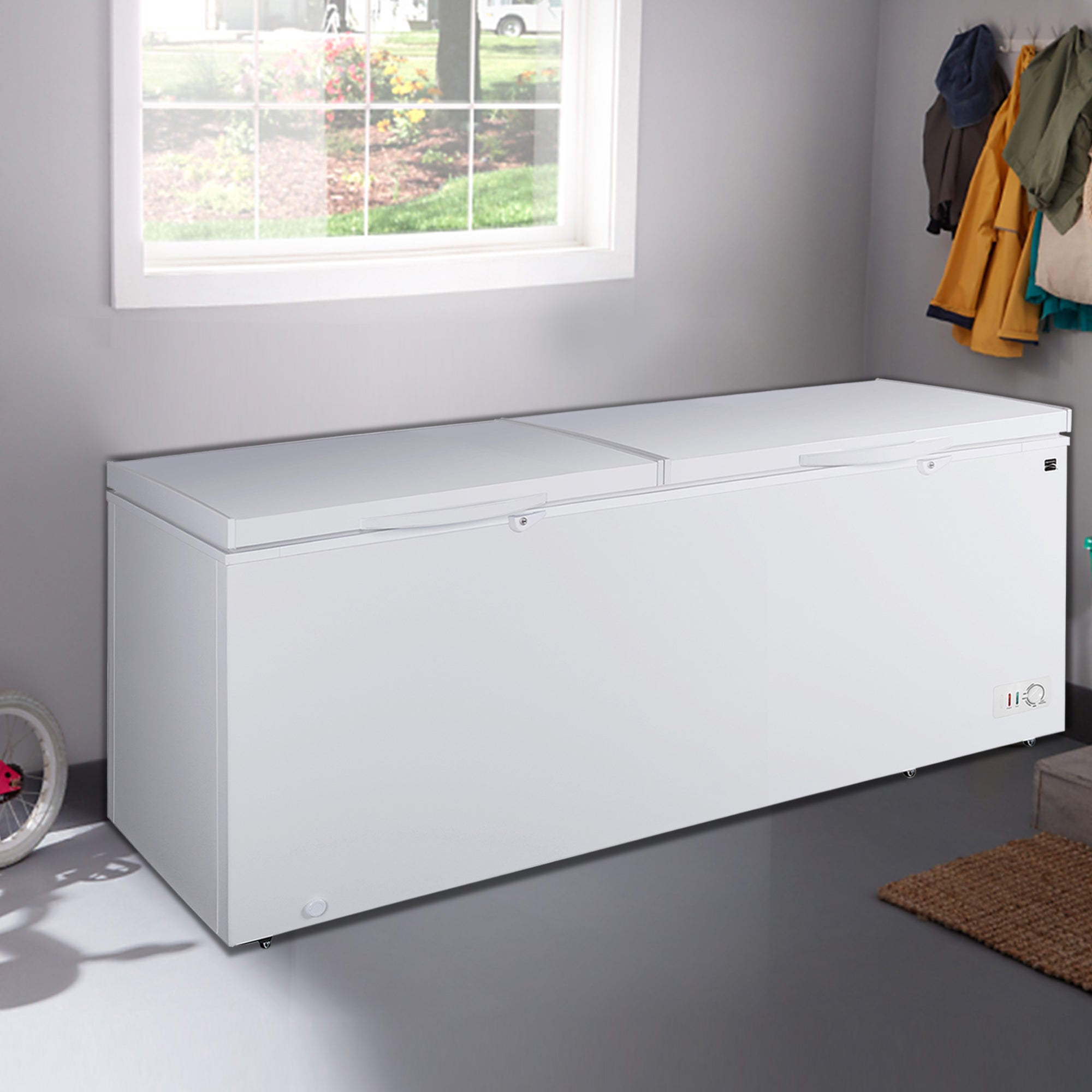 Kenmore convertible chest freezer/refrigerator, closed, in a mudroom with a window behind it