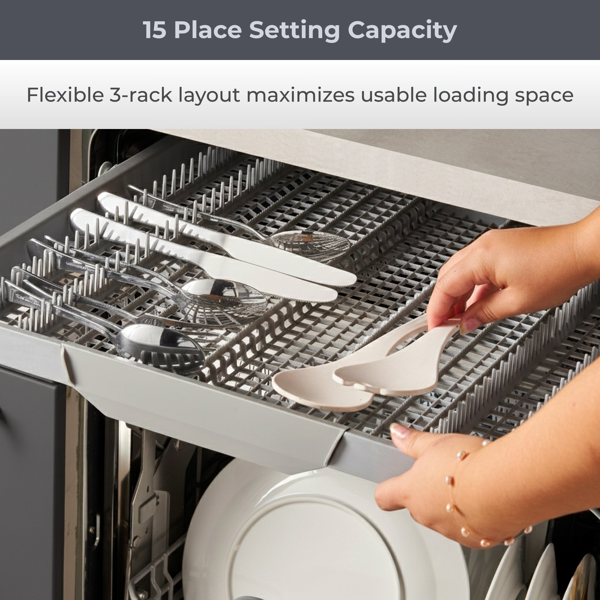 Closeup of a person's hands placing cutlery in the removable top rack of the Kenmore ultra-quiet 24-inch top control dishwasher. Text above reads, “15 Place Setting Capacity: Flexible 3-rack layout maximizes usable loading space"