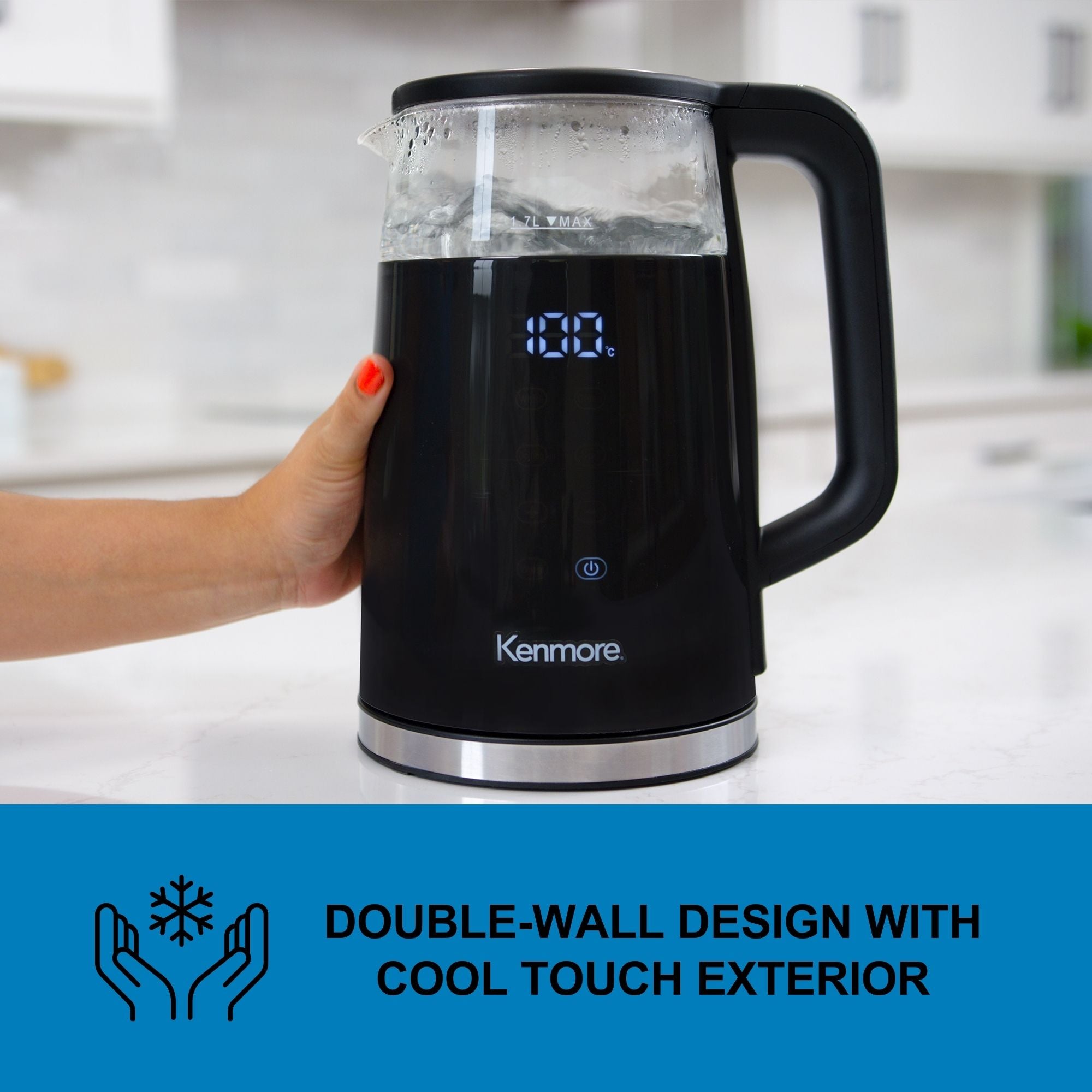 Kenmore 1.7L cordless kettle with adjustable temperature and 4 presets on a white counter with a person's hand touching the side. Text below reads, "Double wall cool-touch design"