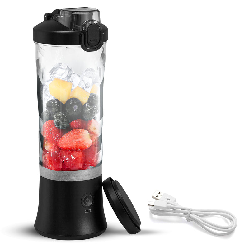Product shot of Total Chef personal cordless blender filled with strawberries, blueberries, and ice cubes, with travel base cover and USB power cord beside it on a white background