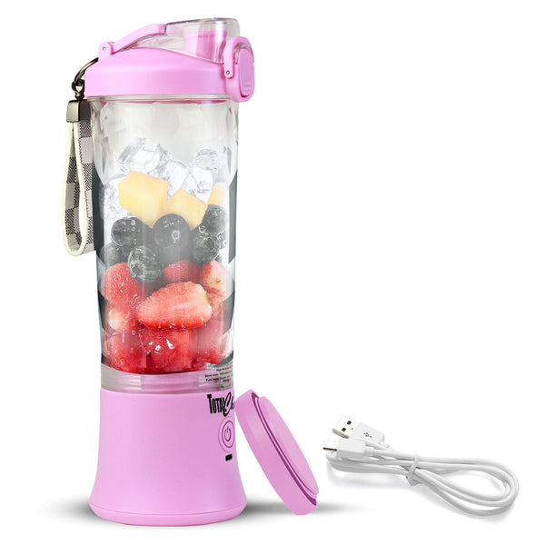 Product shot of Total Chef personal cordless blender filled with strawberries, blueberries, and ice cubes, with travel base cover and USB power cord beside it on a white background