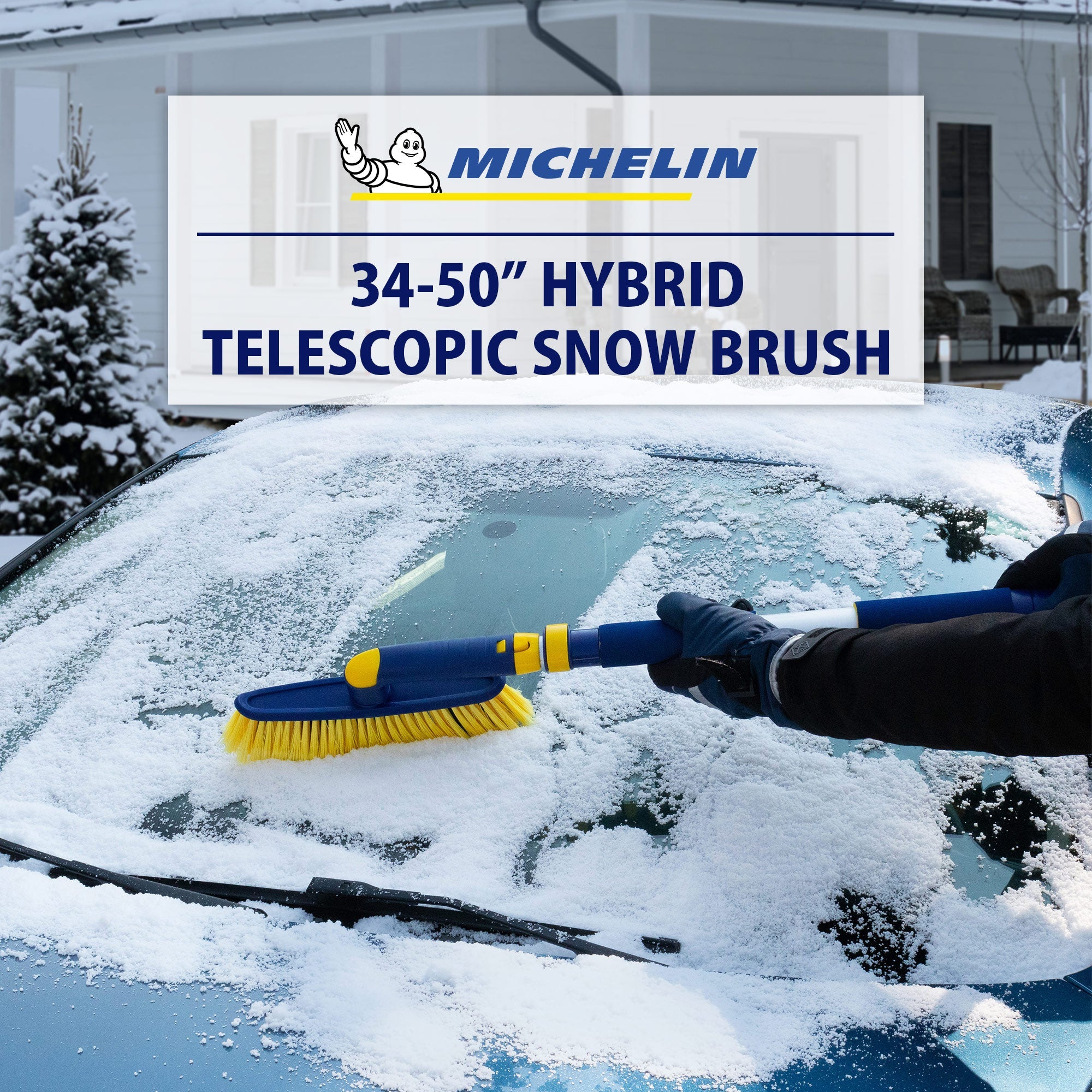 Lifestyle image of a gloved hand using the snow brush, extended, to remove snow from the windshield of a dark coloured car. Transparent white overlay above shows the Michelin logo above text reading "34-50" hybrid telescopic snow brush"