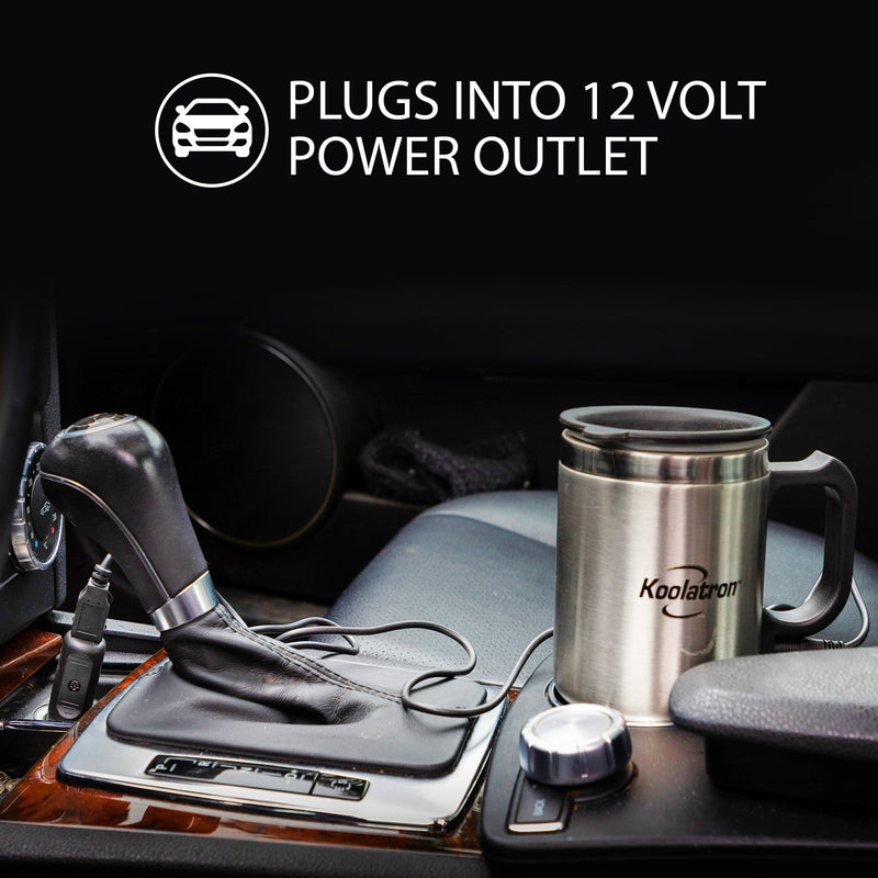 Lifestyle image of insulated travel mug with USB/12V powered heater in the cupholder of a vehicle with black leather interior. Text and icon above describe "plugs into 12 volt power outlet"