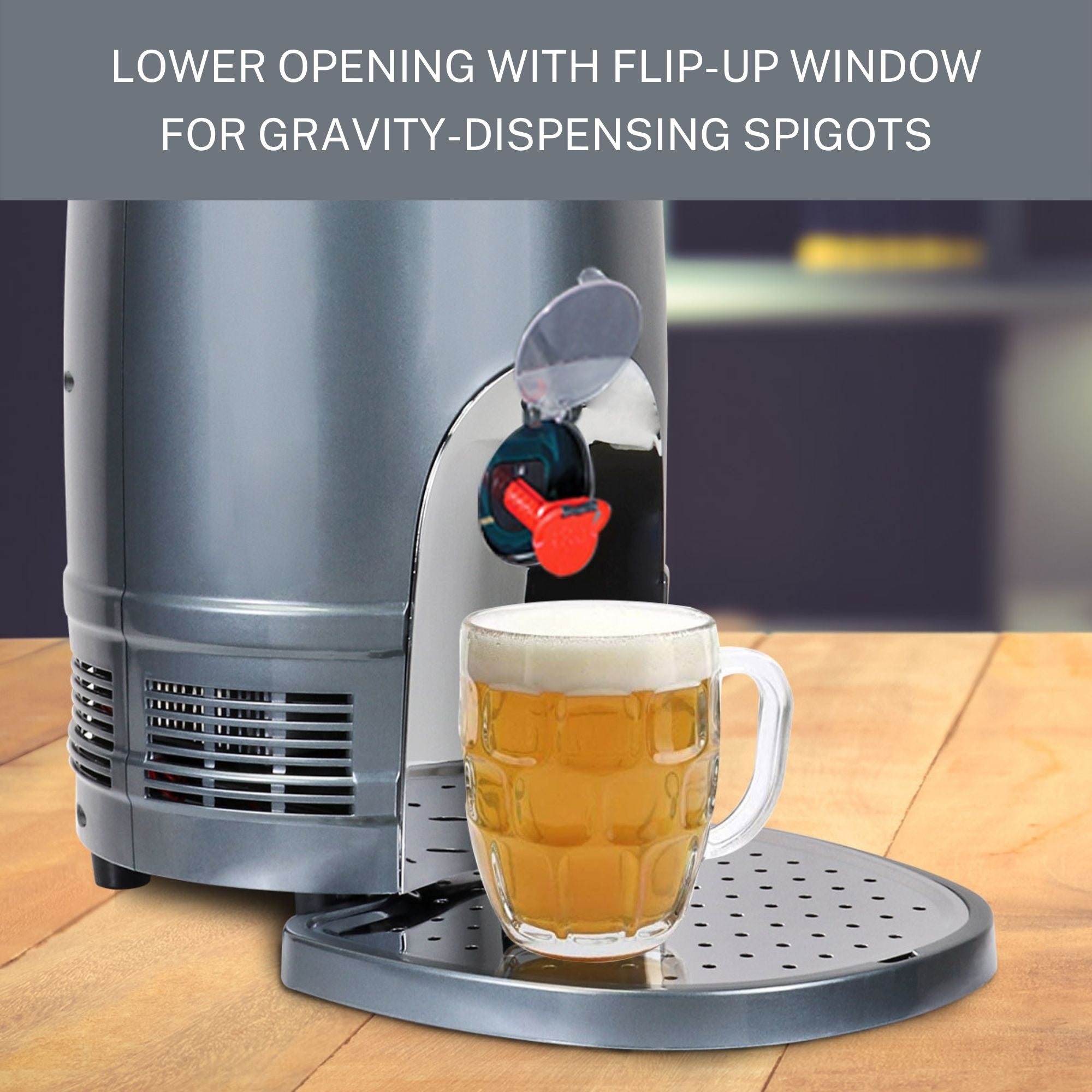 Lifestyle image shows the bottom half of the mini keg cooler on a wood plank table with a full beer mug positioned below a red plastic spigot in the lower opening. Text above reads, "Lower opening with flip-up window for gravity-dispensing spigots."