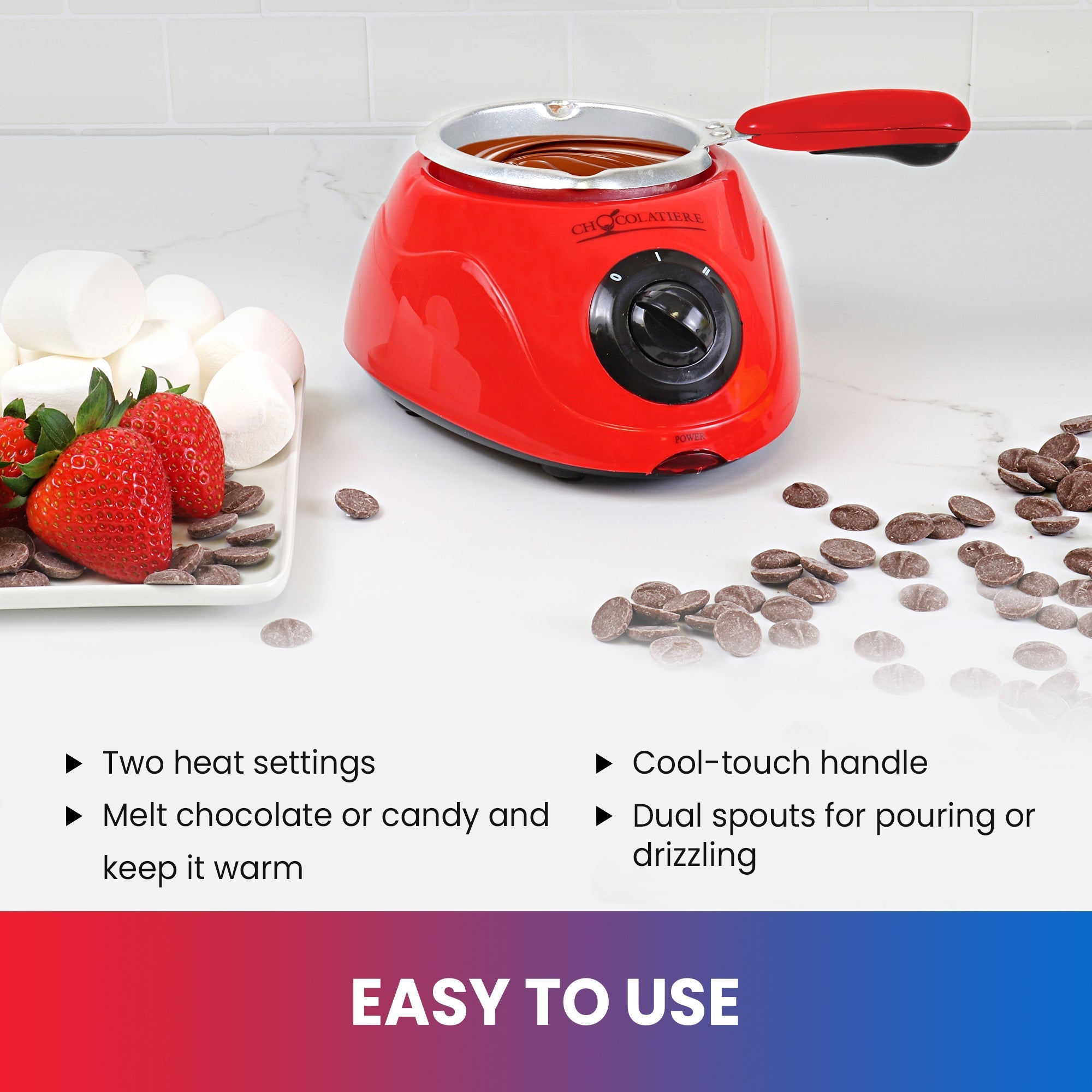 Lifestyle image of chocolate fondue pot on a white counter with a plate of strawberries and marshmallows on the left and unmelted chocolate discs on the right. Text below reads, "Easy to use: Two heat settings; Melt chocolate and keep it warm; 8.8 oz (250 gram) capacity; Cool-touch handle; Dual spouts for pouring or drizzling"