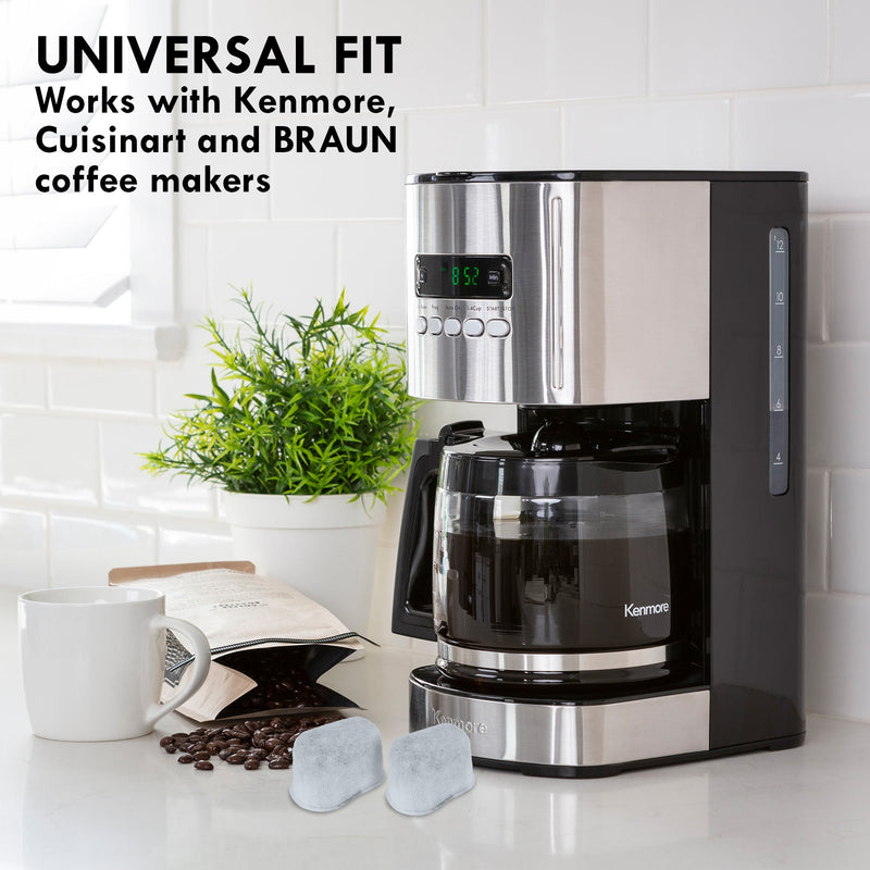 Lifestyle image of Kenmore 12 cup programmable coffeemaker on a light gray countertop with white tile backsplash behind and two charcoal water filter cartridges, a mug, bag of coffee beans, and potted plant beside it. Text above reads, "Universal fit: Works with Kenmore, Cuisinart, and Braun coffee makers"