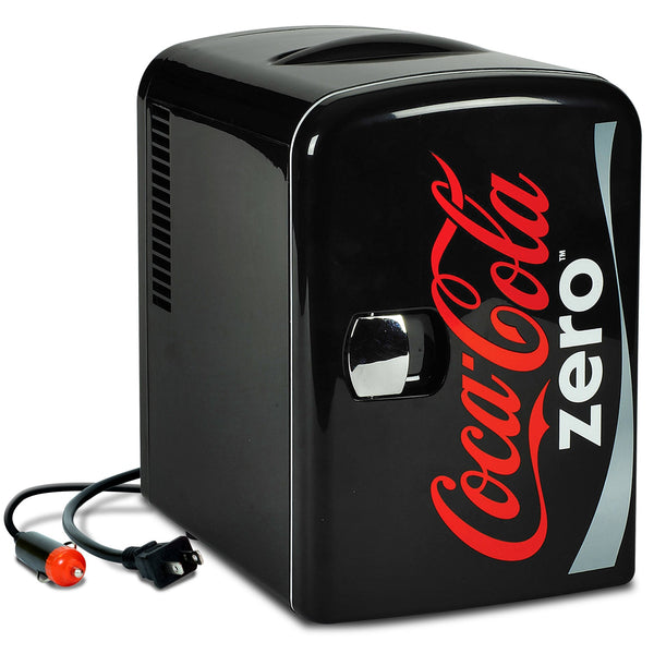 Product shot of Coca-Cola Coke Zero 4L mini fridge, closed, with AC and DC power cords visible, on a white background