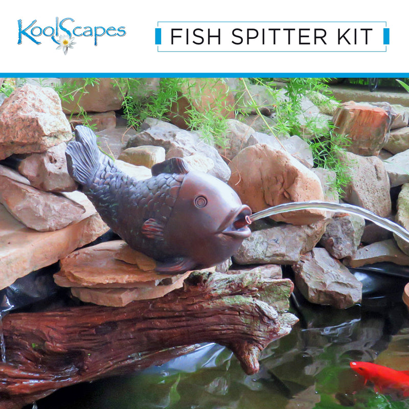 Lifestyle image of Koolscapes fish spitter water feature set up on a flat stone on the side of a backyard pond with green grass with a bright green plants and terracotta planters in the background and a stream of water flowing into the pond above a bright orange goldfish.Text above reads, “Koolscapes Fish Spitter Kit”