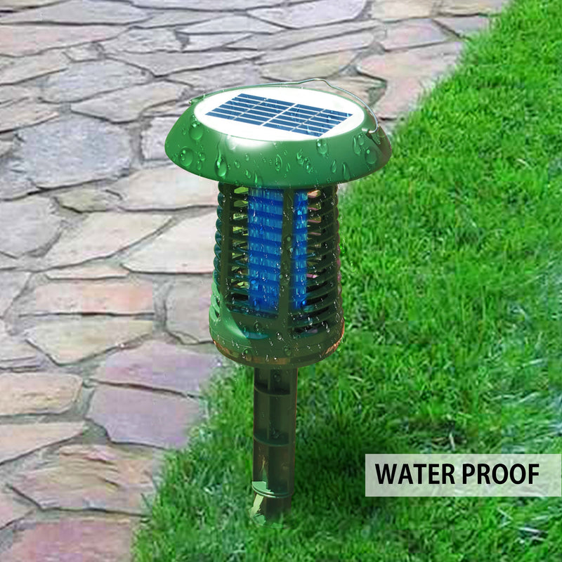 Lifestyle image of the Bite Shield solar powered electronic flying insect zapper with water drops all over it mounted on the ground stake in grass to the right of a stone pathway. Inset text reads, "Waterproof"