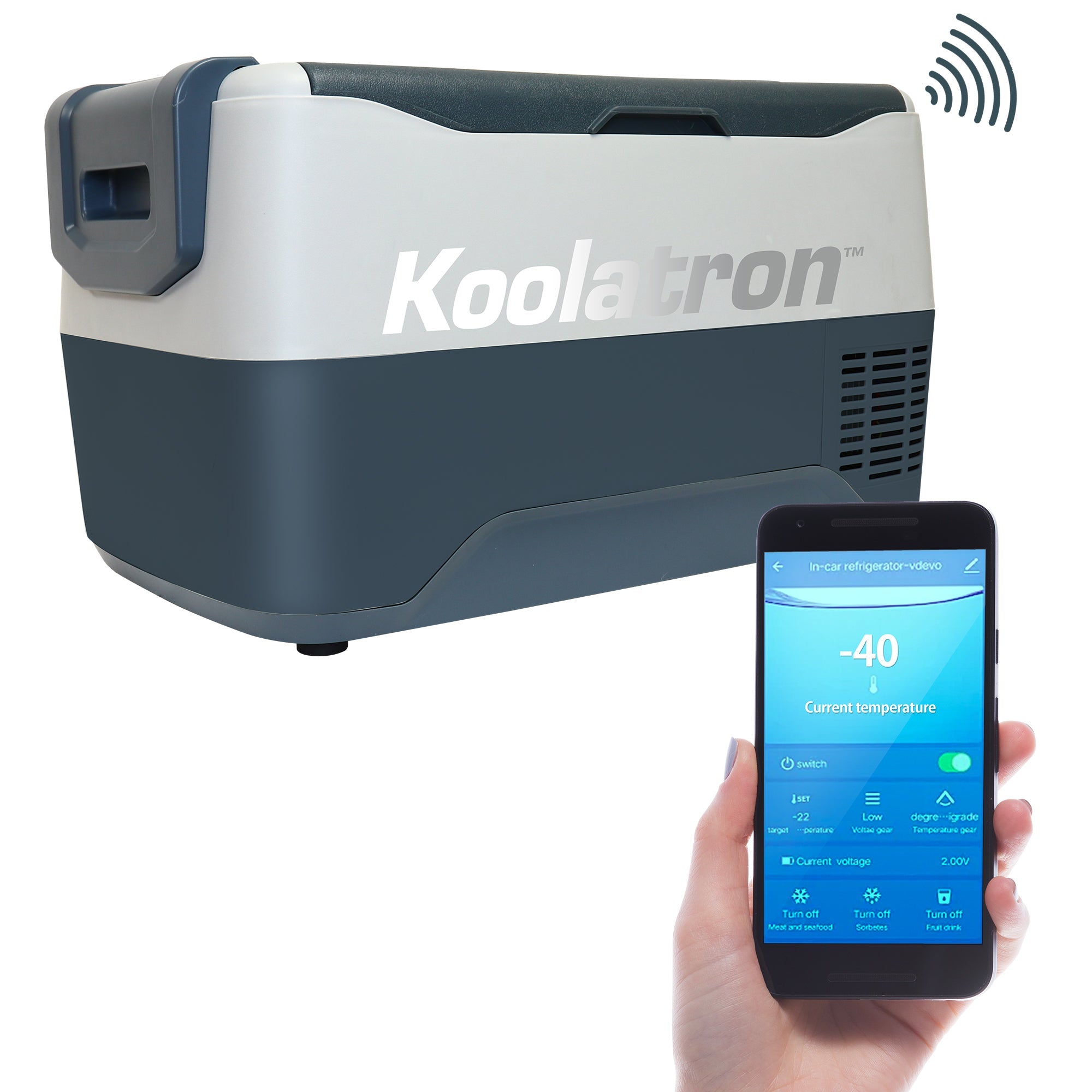 Product shot of 12V travel fridge/freezer on a white background with a person's hand holding a smartphone with the Koolatron Smart app on the screen in the foreground