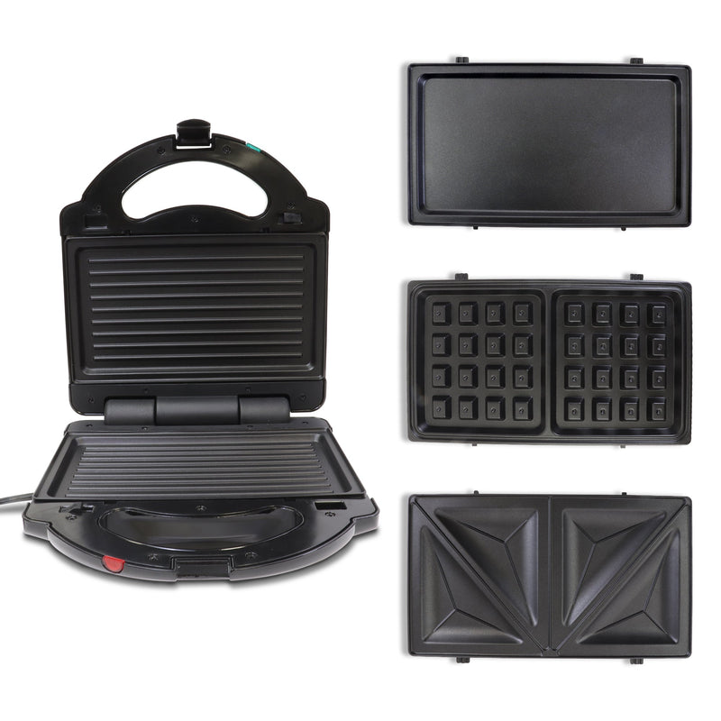 Product shot of 4 in 1 grill and waffle maker on white background with grill plates in place and flat griddle, waffle, and grilled cheese plates to the right