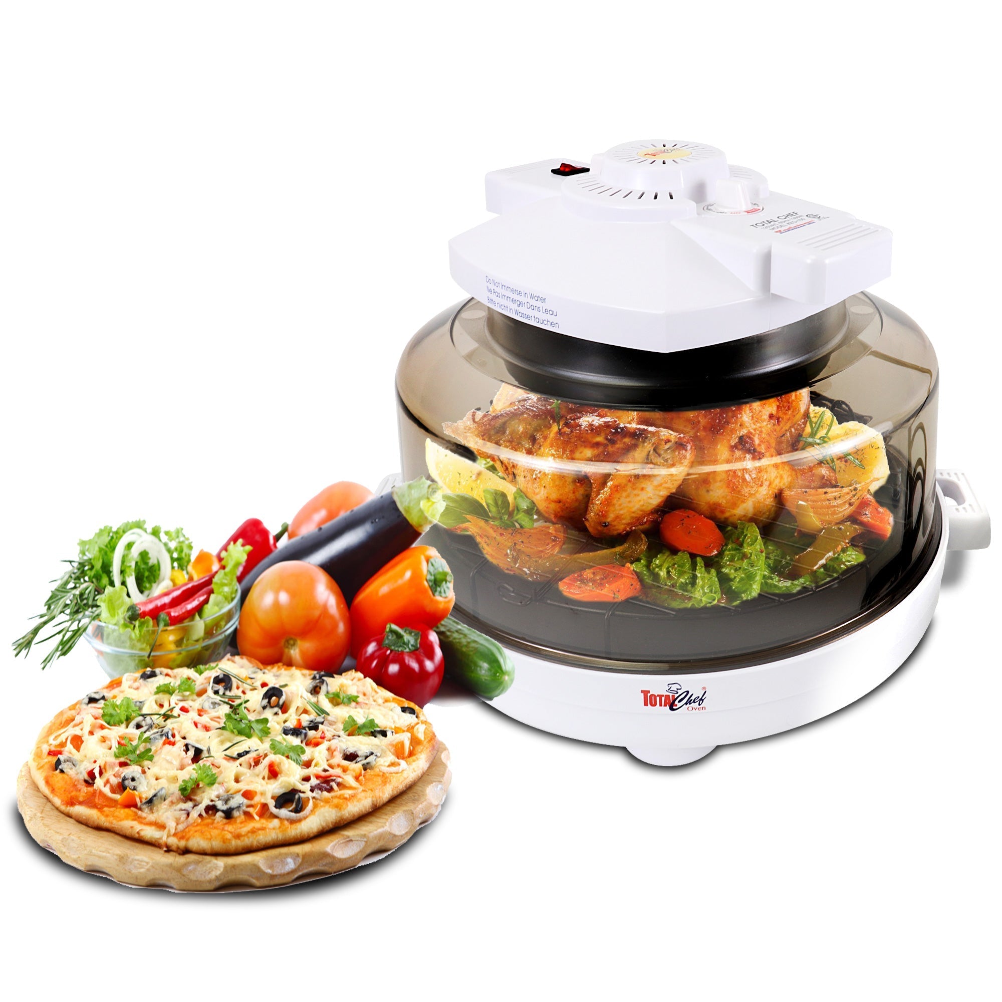 Product shot of Total Chef infrared oven with a roast chicken dinner inside and a pizza and several raw vegetables beside it on a white background